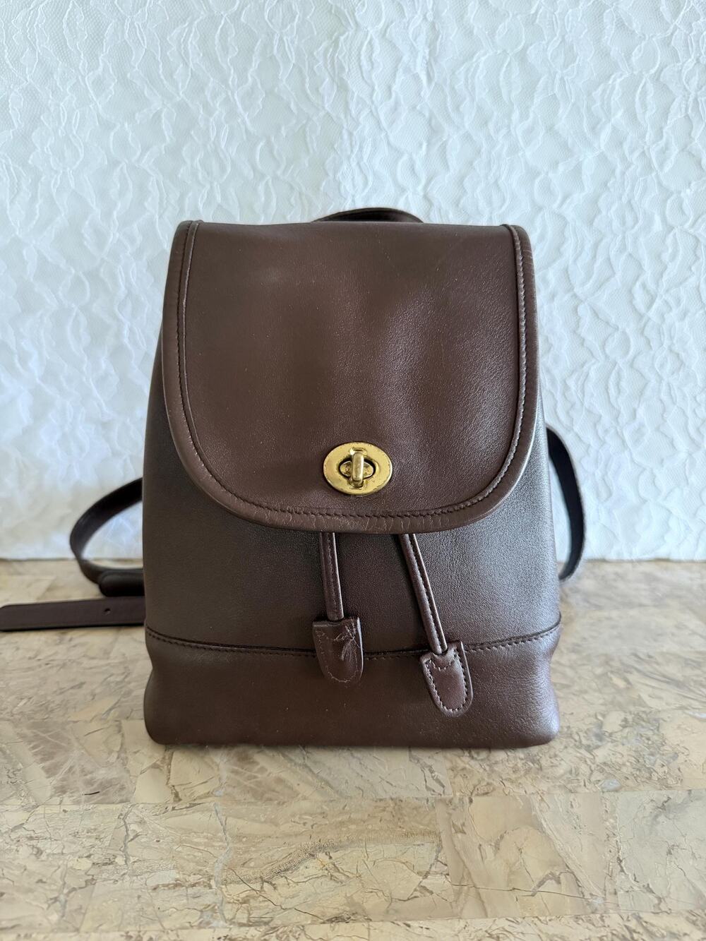 Vtg small brown coach leather/glove tanned backpack serial# 9960